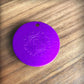 Large purple plate disc on wood background