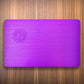Small authentic purple plate on a wood surface