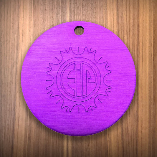 Large Tesla Purple Energy disc authentic on wood surface