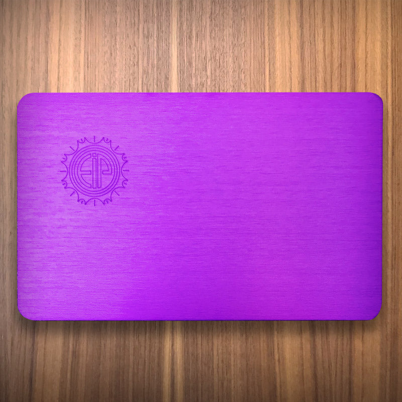 Small authentic purple plate on a wood surface