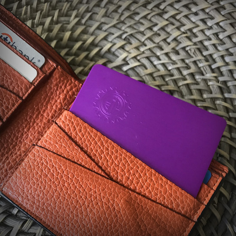Tesla Purple plate wallet size in wallet with orange inside